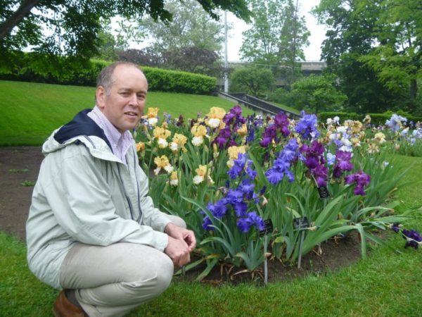 Carlo Balistrieri takes a break among the irises in the Laking Garden.