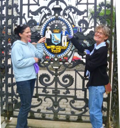 Tracy Jessen and Helen MacLean show off the refurbished Victorian gates.