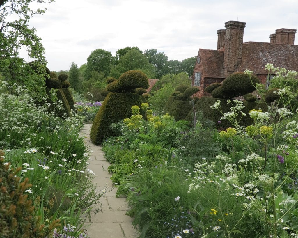 The iconic topiaries at Great Dixter and double borders bursting with feathery perennials. A great contrast of solid and light.